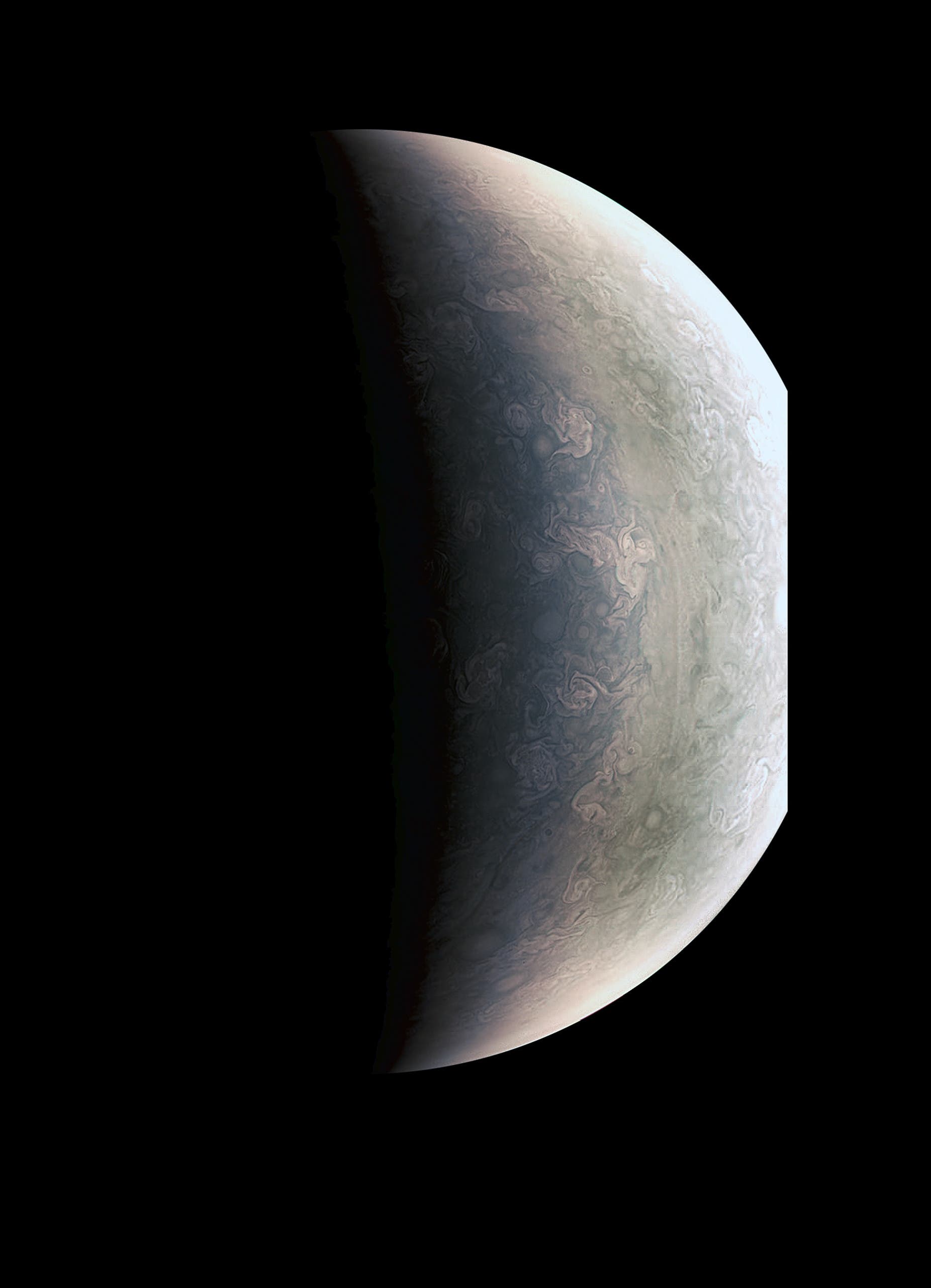 This image from NASA's Juno spacecraft provides a never-before-seen perspective on Jupiter's south pole. The JunoCam instrument acquired the view on August 27, 2016, when the spacecraft was about 58,700 miles (94,500 kilometers) above the polar region. At this point, the spacecraft was about an hour past its closest approach, and fine detail in the south polar region is clearly resolved. HO / NASA / AFP