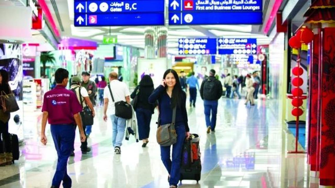 صينيون في مطار دبي