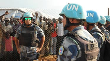 U.N. peacekeepers stand guard at a demonstration by people displaced in the recent fighting, during a visit by the United Nations Security Council, delegation to the UN House in Jebel, near South Sudan's capital Juba, September 3, 2016. REUTERS