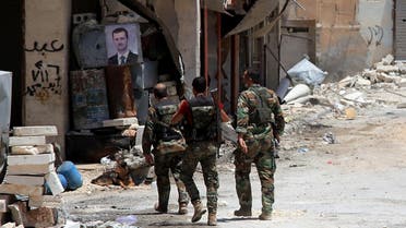 Syrian army soldiers patrol in government-controlled Aleppo's al-Khalidiya area where the army progressed towards the industrial zone of al-Layramoun and Bani Zeid on June 28, 2016. AFP