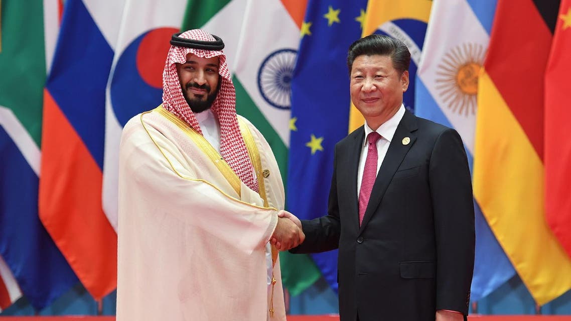Saudi Arabia's Deputy Crown Prince and Minister of Defense Muhammad bin Salman Al Saud shakes hands with China's President Xi Jinping (R) before the G20 leaders' family photo in Hangzhou on September 4, 2016. AFP