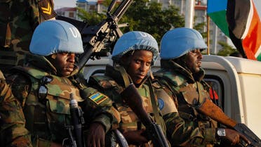 United Nations peacekeepers from Rwanda wait to escort members of the U.N. Security Council as they arrive at the airport in the capital Juba, South Sudan Friday, Sept. 2, 2016. The U.N. Security Council arrived Friday in South Sudan's capital to threaten an arms embargo and sanctions if the government rejects a plan to bring in another 4,000 peacekeepers. (AP Photo/Justin Lynch)