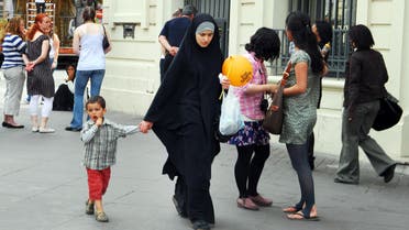 MARSEILLE - MAY 10 2008:Muslim woman wearing hijab in Marseille,France.Since 2011 it is illegal to wear a face-covering veil or other mask in public places such as street, public transport and parks. (shutterstock)