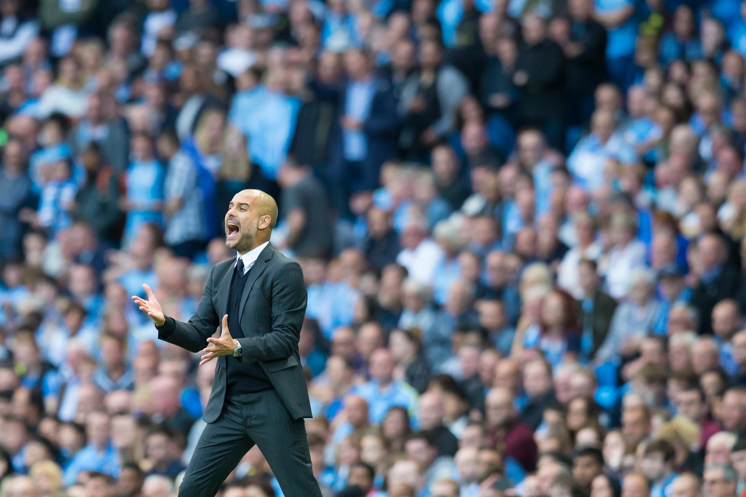 Manchester City's new manager Pep Guardiola reacts after a missed opportunity during the English Premier League soccer match between Manchester City and Sunderland at the Etihad Stadium in Manchester, England, Saturday Aug. 13, 2016. (AP