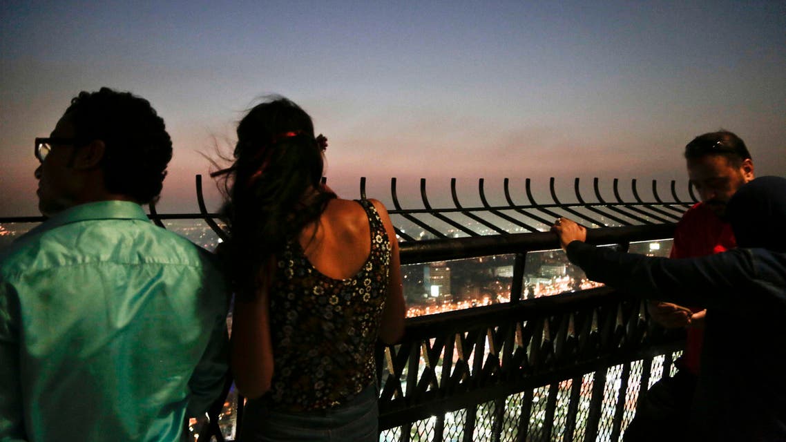 Couples enjoy the view from an observation deck of the Cairo Tower in Egypt, Wednesday, Aug. 17, 2016. (AP)