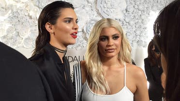 Sisters Kendall Jenner, left, and and Kylie Jenner speak to the media at a party for their KENDALL + KYLIE collection in downtown Manhattan. (Reuters)