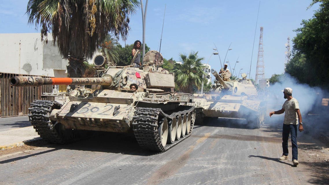 Members of Libyan forces allied with the U.N.-backed ride their tanks during a battle with Islamic State militants in Sirte, Libya September 6, 2016. REUTERS/Hani Amara