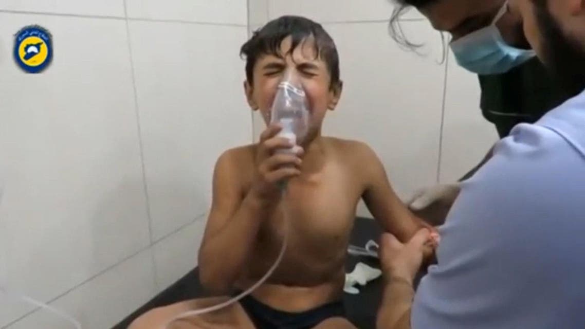 A still image taken on September 7, 2016 from a video posted on social media said to be shot in Aleppo's Al Sukari on September 6, 2016, shows a boy breathing with an oxygen mask inside a hospital, after a suspected chlorine gas attack, Syria. Social Media via Reuters