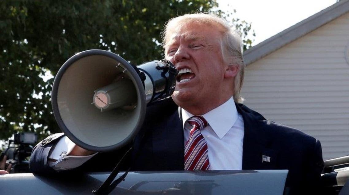 Republican presidential nominee Donald Trump speaks to supporters through a bullhorn during a campaign stop at the Canfield County Fair in Canfield, Ohio, U.S., September 5, 2016. REUTERS