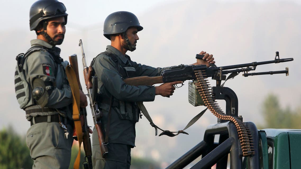 Afghan security forces stand guard after an attack on the American University of Afghanistan in Kabul, Afghanistan, Thursday, Aug. 25, 2016. The attack has ended, a senior police officer said Thursday, after several people were killed. Kabul police Chief Abdul Rahman Rahimi said the dead included one guard, and that about 700 students had been rescued. (AP Photo/Rahmat Gul)