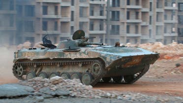A fighter of the Syrian Islamist rebel group Jabhat Fateh al-Sham, the former al Qaeda-affiliated Nusra Front, rides in an armoured vehicle in the 1070 Apartment Project area in southwestern Aleppo, Syria August 5, 2016. (Reuters)