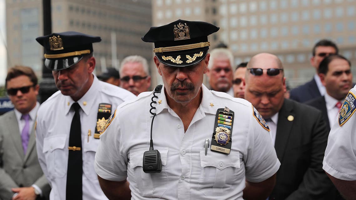 NEW YORK, NY - SEPTEMBER 09: Police pause during a procession in Lower Manhattan to mark the 15th anniversary of the 9/11 attacks and the police officers who were killed during and after the event on September 9, 2016 in New York City. Families, officers and friends gathered for remarks and a wreath laying at a wall commemorating fallen officers. Spencer Platt/Getty Images/AFP
