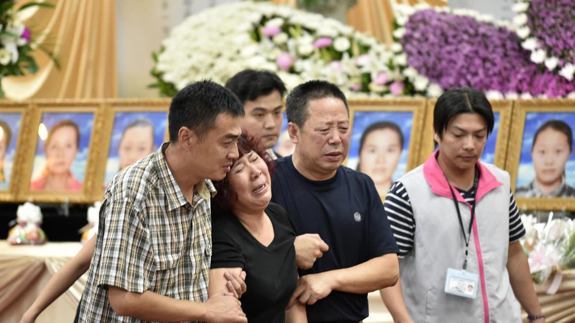 Chinese relatives mourn the loss of victims of a bus crash at Chungli funeral parlour in Taoyuan, northern Taiwan on July 21, 2016. AFP