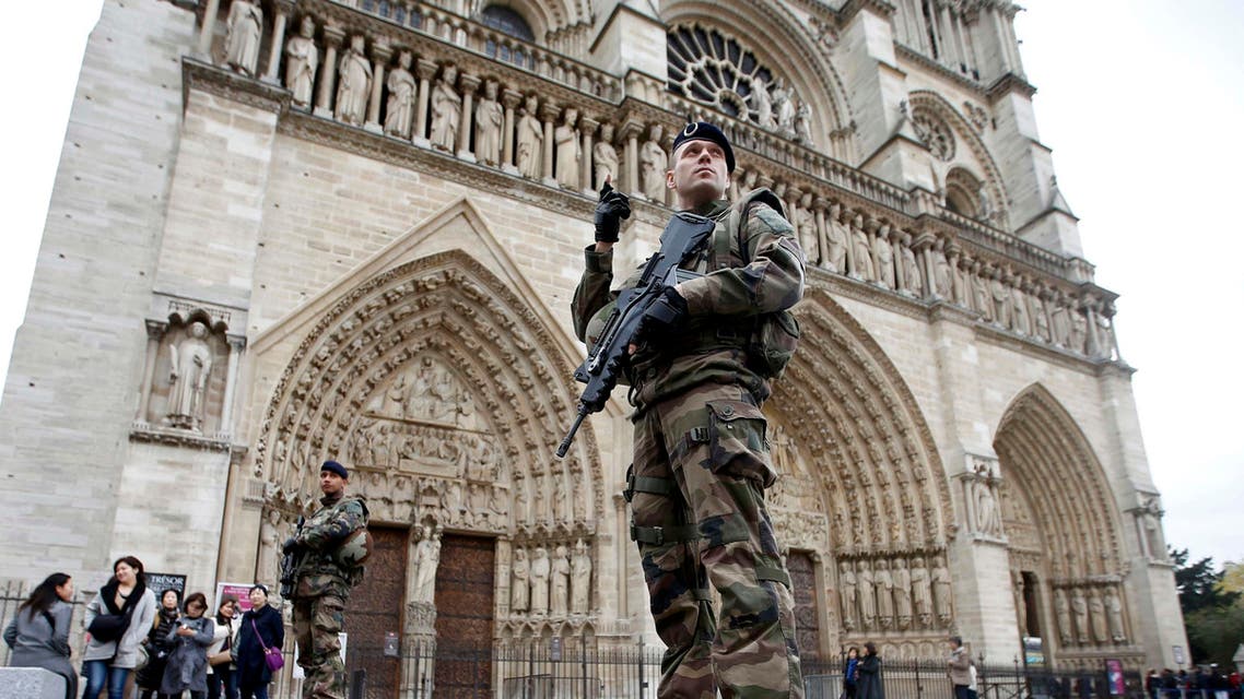 Soldiers patrol in front of the Notre Dame Cathedral in Paris, France, November 16, 2015. REUTERS