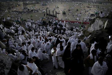 Muslim pilgrims pray on a rocky hill known as Mountain of Mercy, on the Plain of Arafat, during the annual hajj pilgrimage. (AP) 