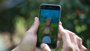 Pokemon Go player attempts to catch Charmander, one of Pokemon's most iconic creature, in New Delhi, India. (AP)