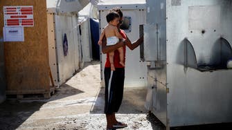 EU says Greece must improve shelter for migrant children 