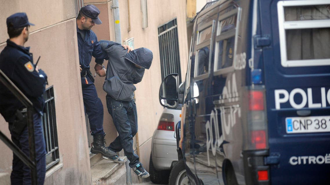 Police escort a suspect detained in an operation against a group suspected of financing and recruiting Islamist militants in Santa Coloma de Gramanet, near of Barcelona, Spain, Thursday, Oct 16, 2008. (File photo: AP)