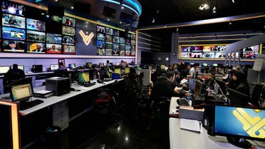 Employees work in the newsroom of Hezbollah’s Al-Manar TV station, in the southern suburb of Beirut, Lebanon, Thursday, Dec. 10, 2015. Hezbollah’s Al-Manar TV station has vowed to continue broadcasting after it was abruptly dropped by one of the Middle East's main satellite operators. (AP)