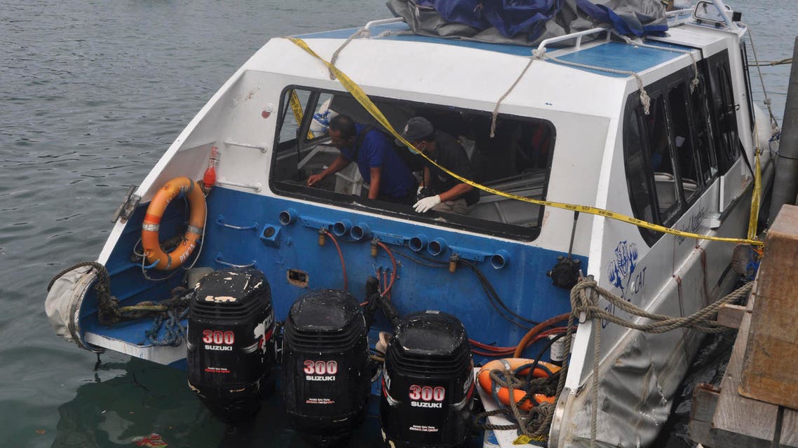 Police investigators examine the Gili Cat 2 boat following an explosion while it was enroute to nearby island of Lombok, at Padangbai Port in Karangasem, Bali, Indonesia, Thursday, Sept. 15, 2016. AP