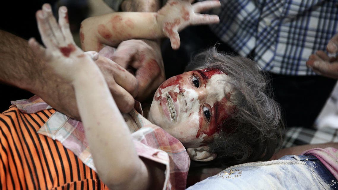 A child reacts inside a field hospital after airstrikes in the rebel held Douma neighbourhood of Damascus, Syria September 12, 2016. REUTERS