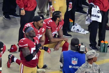 San Francisco 49ers quarterback Colin Kaepernick and teammate 49ers free safety Eric Reid (35) kneel during the playing of the national anthem before a NFL game against the Los Angeles Rams at Levi's Stadium. Mandatory Credit: Kirby Lee-USA TODAY Sports