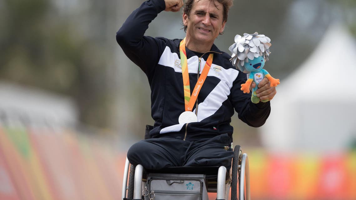 Italy's silver medalist Alessandro Alex Zanardi poses for photos during the medal ceremony for the men's road race H5 hand-cycling event, during the Paralympics Games, in Rio de Janeiro, Brazil, Thursday, Sept. 15, 2016. (AP)