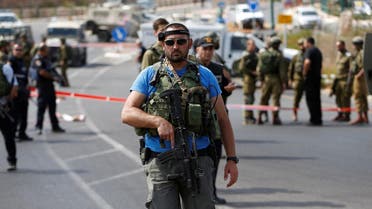 Israeli security forces gather at the scene of what the Israeli military said was a car ramming attack by a Palestinian near the Jewish settlement of Kiryat Arba near the West Bank city of Hebron September 16, 2016. REUTERS