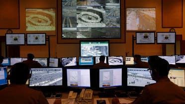 Saudi police officers monitor screens connected to cameras to monitor crowds of pilgrims at holy places in Mina and at the Grand Mosque in Mecca, Saudi Arabia, Wednesday, Oct. 16, 2013. AP