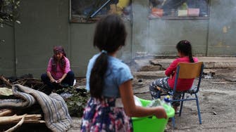 Fire at Greek migrant camp, thousands flee