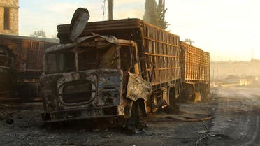 Damaged aid trucks are pictured after an airstrike on the rebel held Urm al-Kubra town. (Reuters)