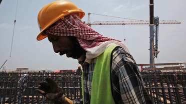  In this May 8, 2014, file photo a man works on construction of the Kingdom Tower, a planned 252-story building, which aims to become the world's tallest skyscraper when complete, in Jiddah, Saudi Arabia. AP