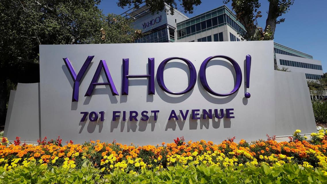 Flowers bloom in front of a Yahoo sign at the company's headquarters (File Photo: AP /Marcio Jose Sanchez)