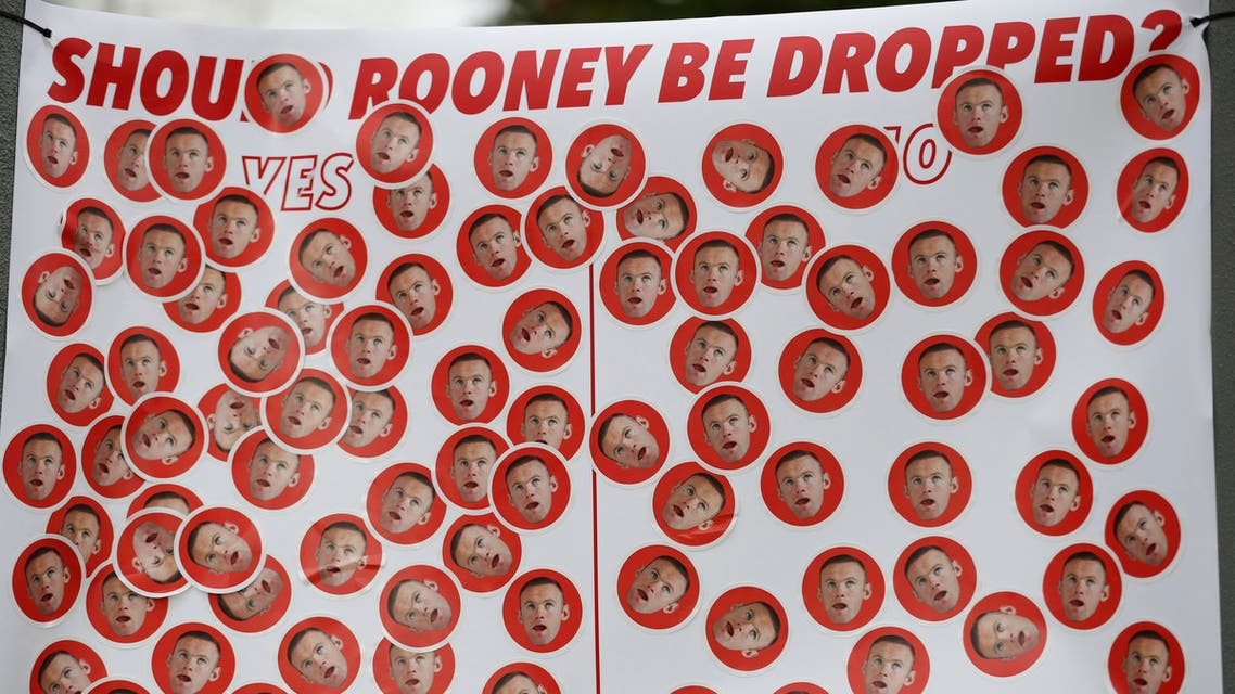 A banner in reference to Manchester United's Wayne Rooney outside the stadium before the match. Reuters
