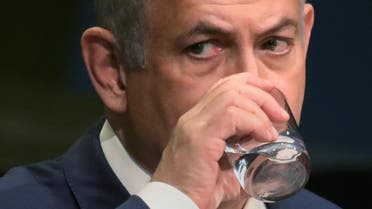 Israel's Prime Minister Benjamin Netanyahu takes a drink of water as he addresses the 71st United Nations General Assembly in the Manhattan borough of New York, U.S., September 22, 2016. REUTERS/Carlo Allegri
