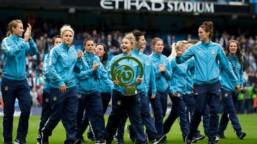 File photo Manchester City Women's football team as parade their recently won Continental Cup trophy on Oct. 18, 2014. (AP Photo)