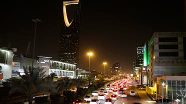 Cars pass by the kingdom tower Sunday, June 14, 2015, in Riyadh, Saudi Arabia. AP