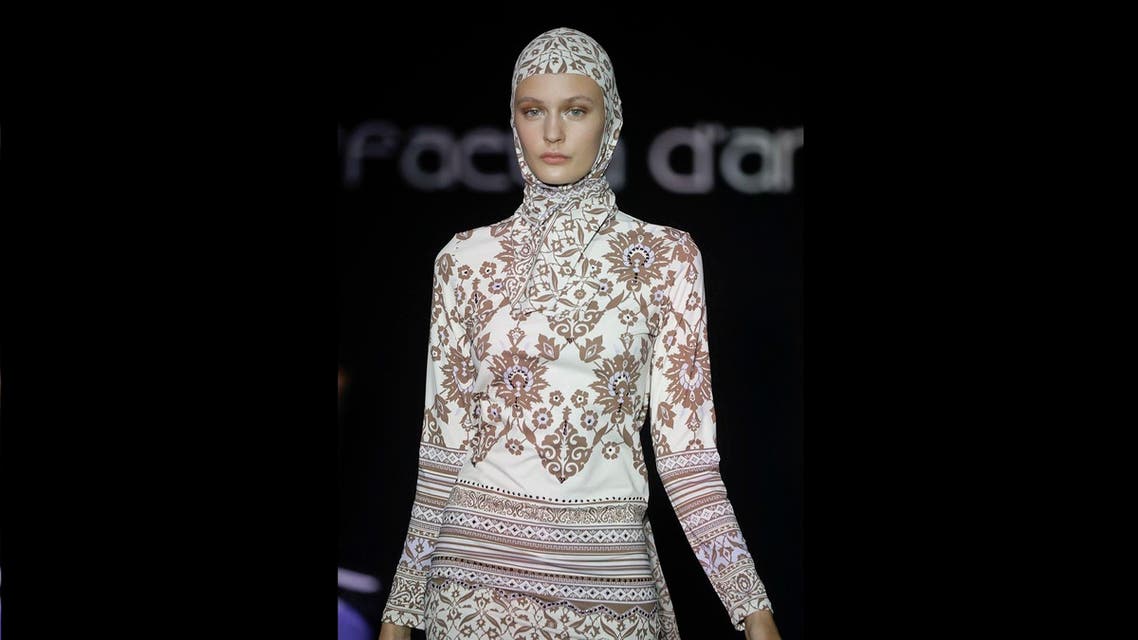 A model wears a creation for the Raffaella D'Angelo women's Spring-Summer 2017 collection, that was presented in Milan, Italy, Saturday, Sept. 24, 2016. AP