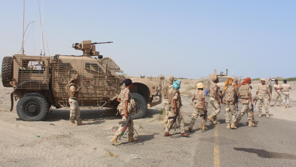 Yemeni pro-government fighters walk in front of a military vehicle, before heading to Zinjibar, the capital of Yemen's southern province of Abyan, to launch an offensive to recapture the town from al-Qaeda jihadists on August 14, 2016. (AFP)