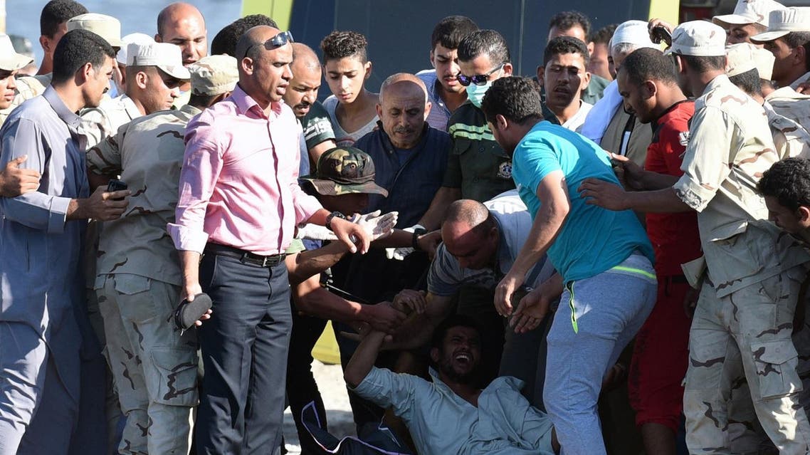 An Egyptian man reacts upon the arrival of a body along the shore in the Egyptian port city of Rosetta. (AFP)
