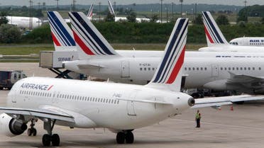 This Thursday, June 13, 2013 file photo shows Air France planes parked on the tarmac at Roissy Charles de Gaulle airport near Paris, France, during an air traffic controllers strike. Air France has cancelled 10 percent of its long-distance flights Friday due to a strike by cabin crew amid mass departures for summer vacation. (AP Photo/Jacques Brinon, File)