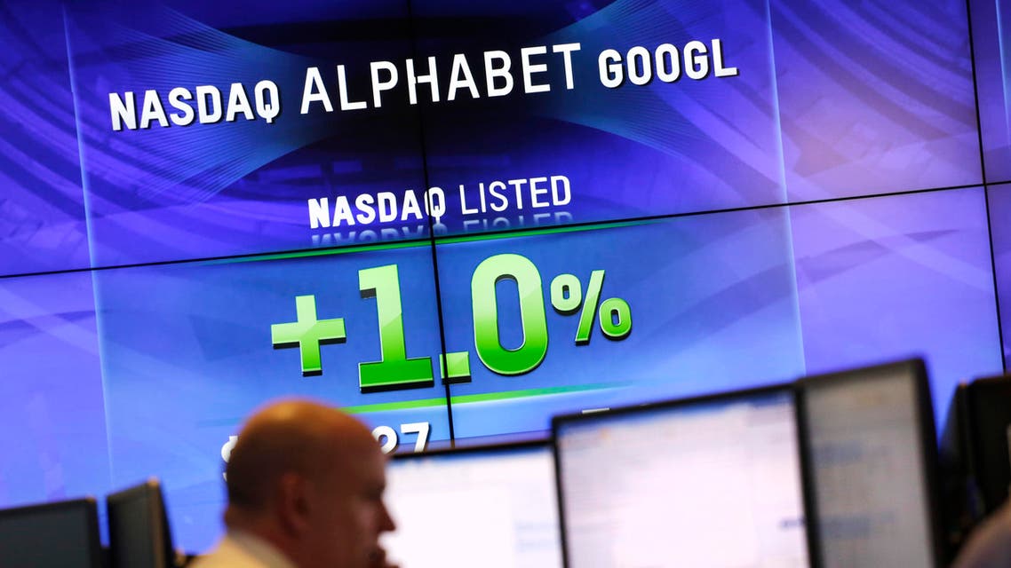Electronic screens post the price of Alphabet stock, Monday, Feb. 1, 2016, at the Nasdaq MarketSite in New York. Alphabet, the parent company of Google, reports quarterly earnings Monday. (AP