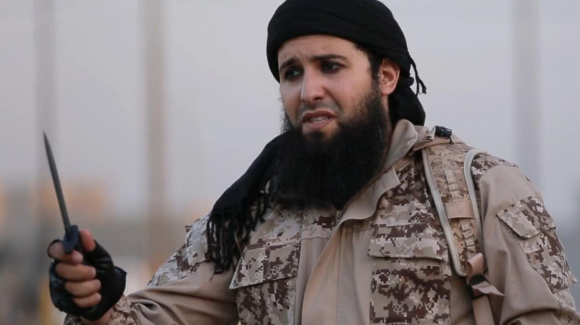 Rachid Kassim, a French member of the Islamic State group (IS), speaking in French to the camera from an undisclosed location before beheading two men along with another jihadist. afp