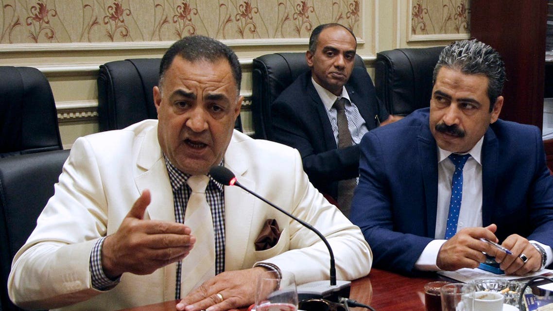 In this Sept. 8, 2016, photo, Egyptian Parliamentary member Ilhami Agena, left, attends the human rights committee in Cairo, Egypt. AP