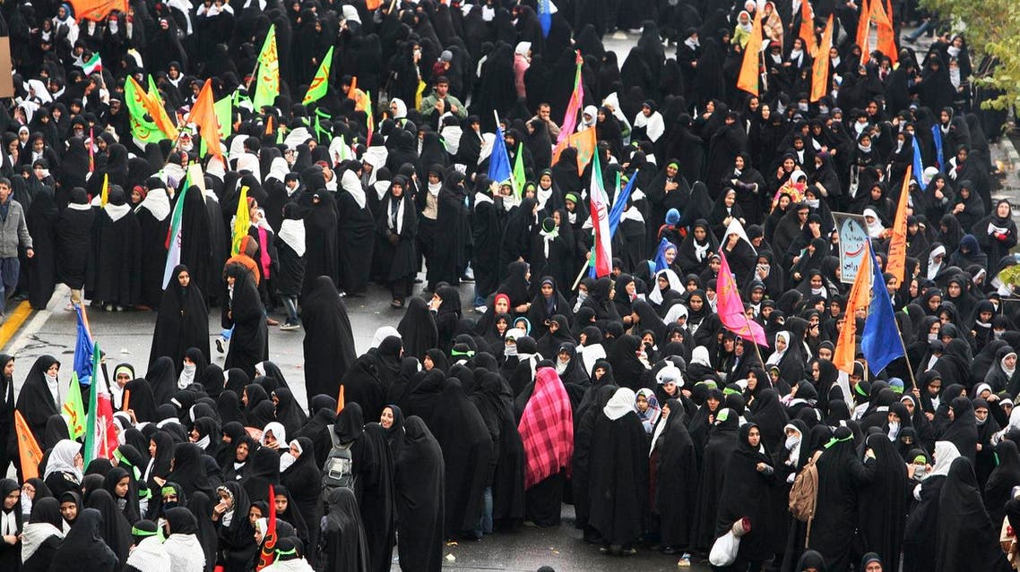 Female members of the Iranian paramilitary Basij force, affiliated with the Revolutionary Guard, attend a rally in front of the former US Embassy in Tehran, Iran, Friday, Nov. 25, 2011. Militant Iranian students seized the embassy on Nov. 4, 1979, believing the embassy to be a center of plots against Iran, and then held 52 Americans hostage for 444 days. The US severed diplomatic ties in response, and the two countries have not had formal relations since. (AP Photo/Vahid Salemi)