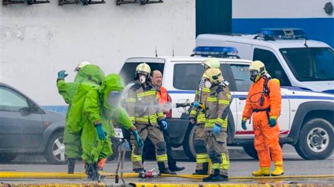 A fireman spotted near to a factory following an explosion in the small village of Ondarroa, northern Spain, Monday, March 14, 2016. (AP)