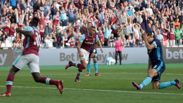 West Ham’s Dimitri Payet, center, celebrates after scoring during the English Premier League soccer match between West Ham and Middlesbrough at The London Stadium in London, Saturday, Oct. 1, 2016.(AP)