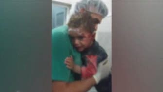 New video from Aleppo: A crying Syrian toddler clinging to his nurse 