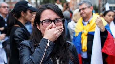 A supporters of the peace accord signed between the Colombian government and rebels of the Revolutionary Armed Forces of Colombia, FARC, cries as she follows on a giant screen the results of a referendum to decide whether or not to support the deal in Bogota, Colombia, Sunday, Oct. 2, 2016. (AP)