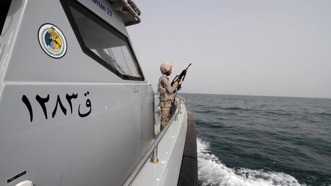 A Saudi border guard watches as he stands in a boat off the coast of the Red Sea on Saudi Arabia's maritime border with Yemen, near Jizan April 8, 2015. Iran sent two warships to the Gulf of Aden on Wednesday, state media reported, establishing a military presence off the coast of Yemen where Saudi Arabia is leading a bombing campaign to oust the Iran-allied Houthi movement. REUTERS